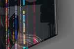 Data-muse artwork anchoring a wall with magenta-and-graphite palette