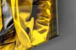 Thinker-muse artwork anchoring a wall with canary-and-graphite palette