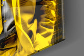 Thinker-muse artwork anchoring a wall with canary-and-graphite palette