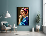 Girl With A Pearl Earring glass wall art styled above a leather chesterfield in a study