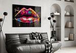 Lips glass wall art styled above a velvet bench in a powder room