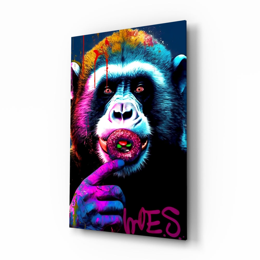 Monkey Kiss glass wall art displayed above a leather sofa in a moody man cave