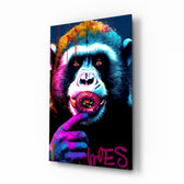 Monkey Kiss glass wall art displayed above a leather sofa in a moody man cave