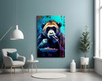 Hungry Monkey glass wall art styled above a sideboard in a media room