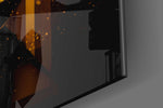 Antihero-muse artwork anchoring a wall with amber-and-onyx palette