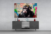 Thinking Monkey panel catching lamp light to reveal its urban grit