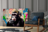 Thinking Monkey glass print enhancing a media room with statement palette