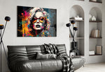 Smarty-Pants glass wall art styled above a console in a creative office
