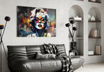 Marilyn Monroe glass wall art styled above a console in a creative office