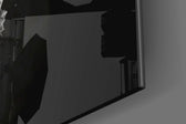 Duality-emblem artwork anchoring a wall with gold-and-onyx palette
