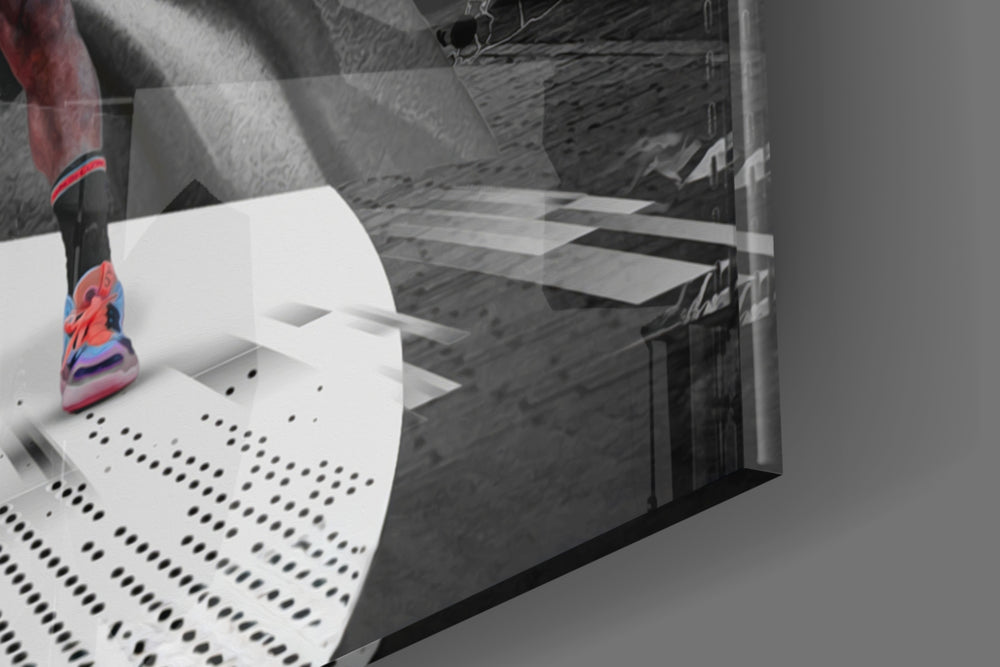 Basketball-legend artwork anchoring a wall with monochrome-and-scarlet palette