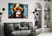 Cool Monkey glass wall art styled above a sideboard in a media room