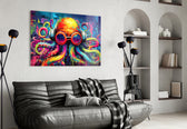 Octopus glass wall art styled above a sideboard in a creative office