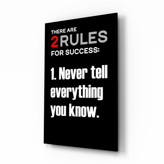 Rules of Success glass wall art displayed above a desk in a home office