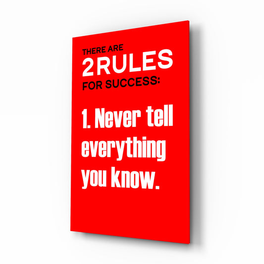 Rules of Success glass wall art displayed above a desk in a home office