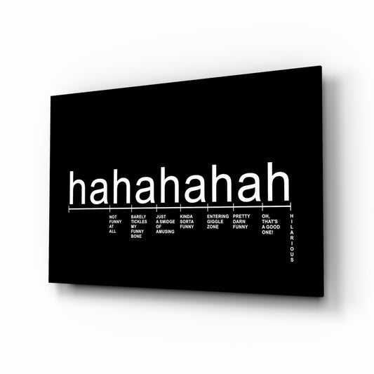 Laughter Analysis glass wall art displayed above a desk in a home office