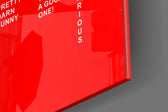 Typography artwork anchoring a wall with scarlet-field palette