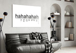 Laughter Analysis glass wall art styled above a sideboard in a media room