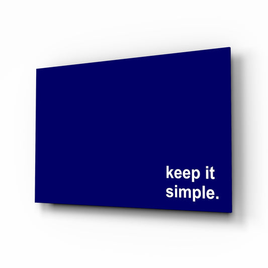 Simple glass wall art displayed above a desk in a home office