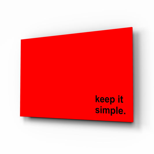 Simple glass wall art displayed above a desk in a home office