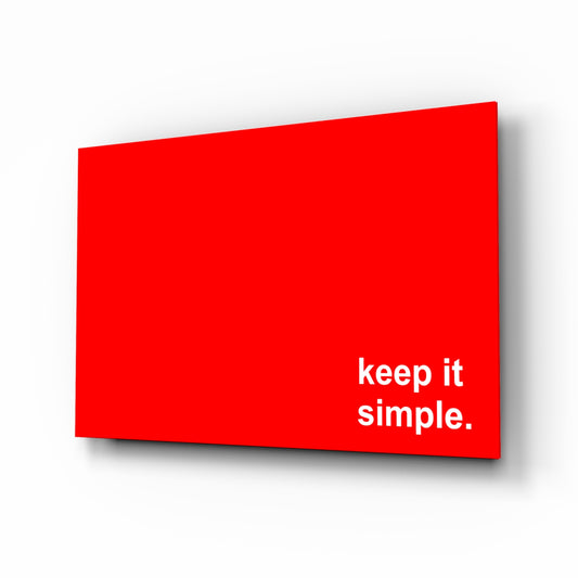 Simple glass wall art displayed above a desk in a home office