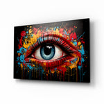 The Eye glass wall art displayed above a desk in a creative office