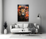 Lion close-up showing gold mane and tangerine floral wreath