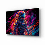 Astronaut glass wall art displayed above a desk in a teen room