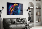 Astronaut glass wall art styled above a sideboard in a creative office