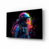 Astronaut glass wall art displayed above a desk in a teen room