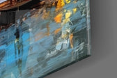 Cityscape artwork anchoring a wall with amber-and-cobalt palette