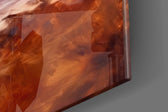 Coastal-portrait artwork anchoring a wall with amber-and-cream palette