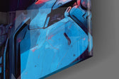 Sci-fi-enforcer artwork anchoring a wall with scarlet-and-charcoal palette