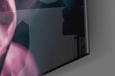 Tupac panel catching lamp light to reveal its cinematic glow