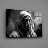 Tupac close-up showing grey hood and dramatic shadow carving
