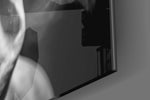 Tupac panel catching lamp light to reveal its cinematic glow