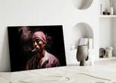 Tupac glass wall art styled above a console in a media room