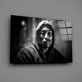 Tupac close-up showing dark hood and dramatic shadow carving