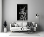 Gun Dog glass wall art styled above a console in a study