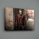 Joker close-up showing maroon suit and clown grin in alleyway