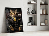 Feline-don artwork anchoring a wall with onyx-and-amber palette