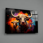 Bull close-up showing curving horns and magenta-cyan splatter