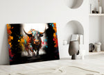 Bull glass wall art styled above a console in a media room