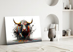 Bull glass wall art styled above a console in a media room
