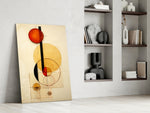 Circular-form artwork anchoring a wall with scarlet-and-amber palette