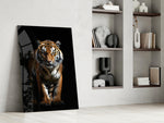 Stalking-predator artwork anchoring a wall with amber-and-onyx palette