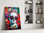 Marble-pop artwork anchoring a wall with magenta-and-multicolor palette
