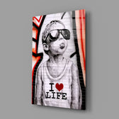 I Love Life close-up showing boy with sunglasses and scarlet drip-graffiti