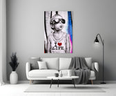 I Love Life glass wall art styled above a console in a media room