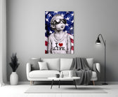 I Love Life glass wall art styled above a console in a media room